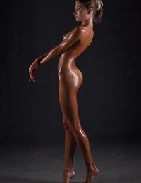 Sofia,Dripping Wet,Stunning young Sofia is dripping with oil as she poses nude in our studio.